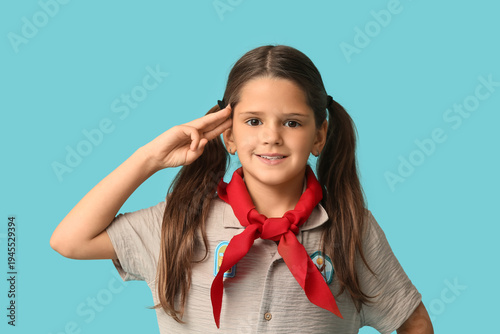 Little girl scout showing s...