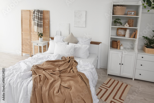 Interior of light bedroom w...
