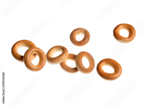 Flying tasty bagels on whit...