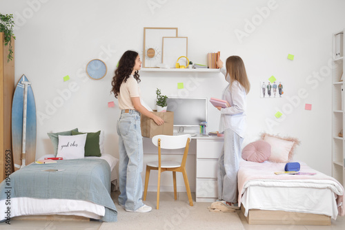 Female students unpacking t...