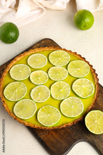 Wooden board with tasty lim...