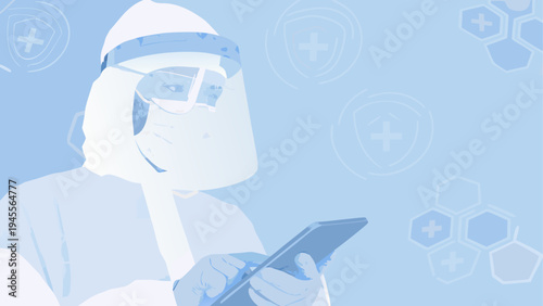 Scientist in protective gear examining a digital tablet with caution