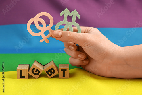 Hand with male, female symb...