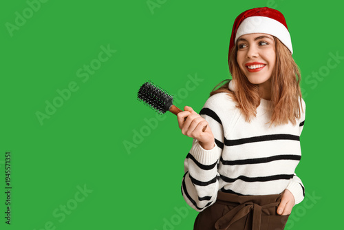 Young female hairdresser in...