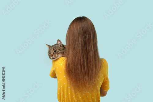 Woman with cute tabby cat o...