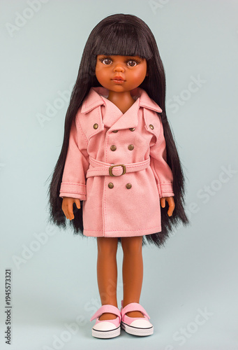 Fotografie Beautiful Realistic vinyl mulatto doll in fashionable and stylish clothes, moder