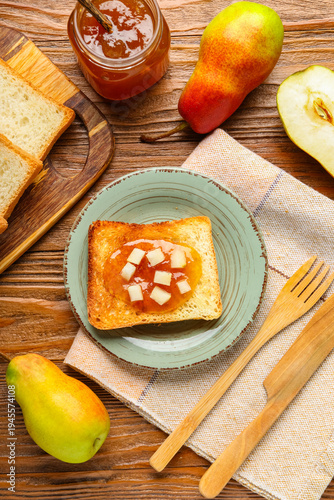 Plate with tasty pear jam a...