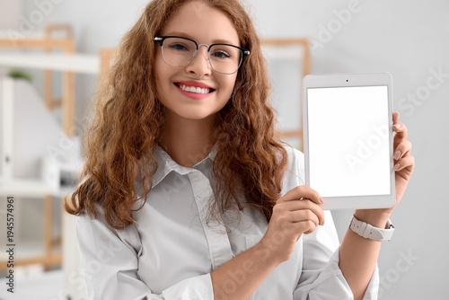Young businesswoman with ta...