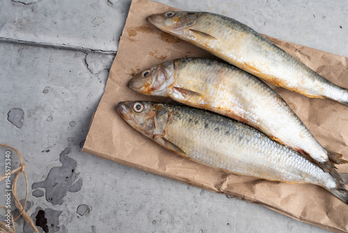 Fresh Whole Sardines on Brown Paper, Rustic Raw Seafood Ingredient