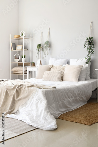 Cozy bed with soft pillows ...