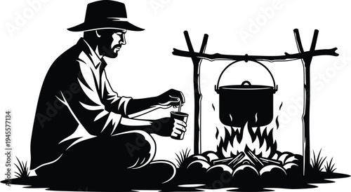 A man cooking over an open flame in the wilderness