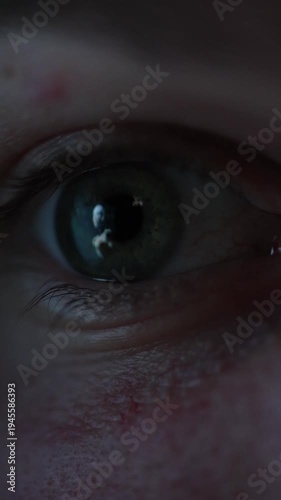 Vertical screen close up human eye with abstract interface reflection symbolizing observation of artificial intelligence development technological progress digital evolution and focused attention on A