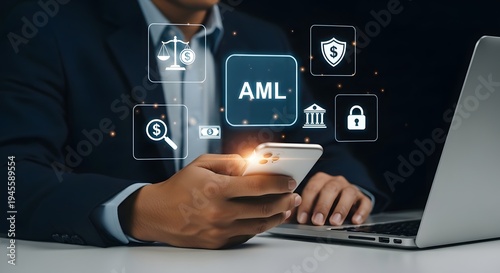 A businessman using a smartphone and laptop with AML and security-related holographic icons appearing