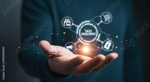 Businessman holding a holographic diagram representing sales enablement and technology integration