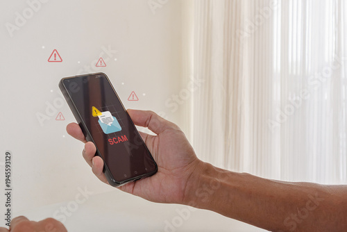 A man receiving a message or email on his smartphone with a warning symbol. Phishing, scam, or spam alert concept.