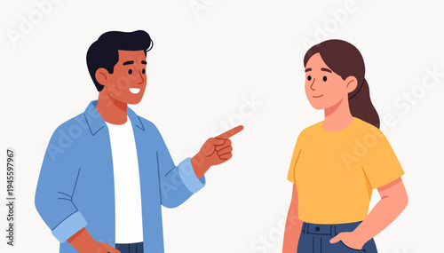 Two people share a friendly, engaging moment. The man smiles, pointing toward the woman. She stands calmly, hands resting gently. Their expressions suggest casual, positive conversation