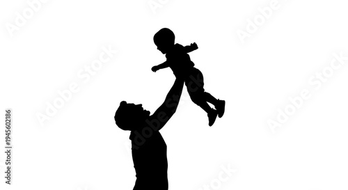 Silhouette of Father Lifting Baby High.