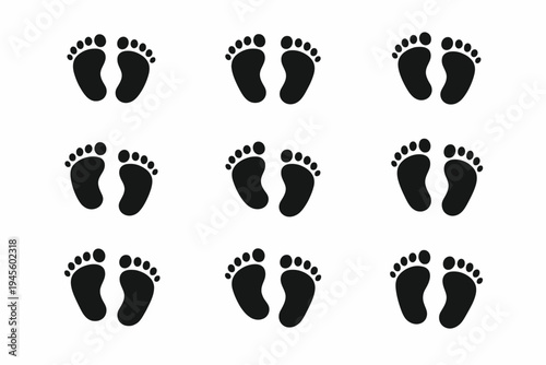 Pattern of black baby footprints on white background