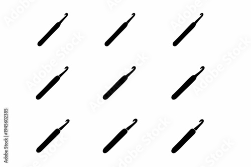 Pattern of black crochet hooks on white background