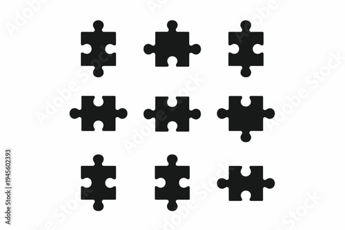 Black jigsaw puzzle pieces on white background arrangement