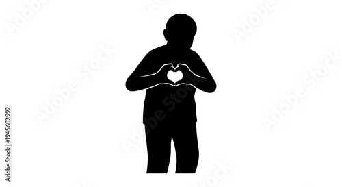 Silhouette of person forming heart shape hands.