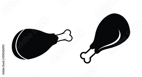 Two fried chicken drumsticks depicted in a striking black silhouette
