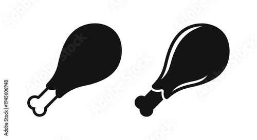 Two black chicken drumsticks presented in a stark graphic silhouette