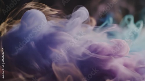 Dynamic blue and orange smoke dissolving into fluid art