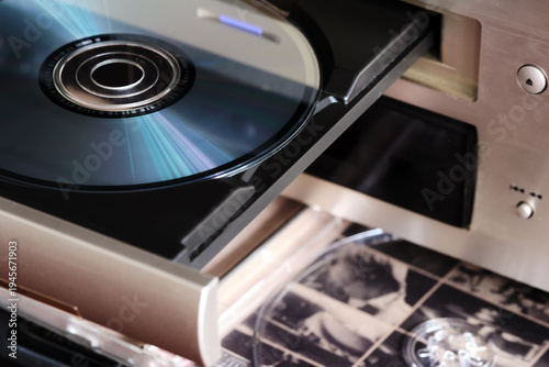 a music disc is loaded into the receiver of a CD, DVD or Blu-ray player
