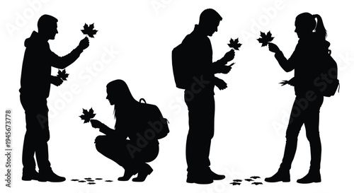 People interacting with falling autumn leaves in a dark silhouette