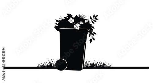 Black trash can overflowing with foliage a striking silhouette