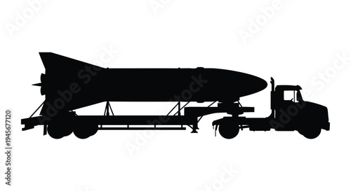 Rocket being transported on a flatbed truck a striking silhouette