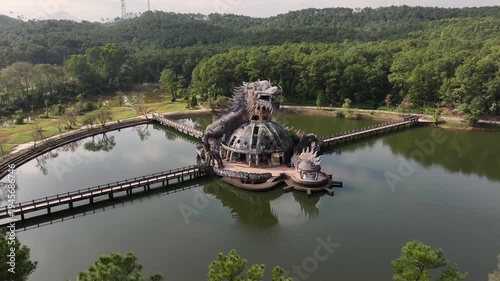 Dragon-Shaped Concrete Structure in Abandoned Lakeside Waterpark in Hue, Vietnam. Aerial Drone Shot of Spectacular Place