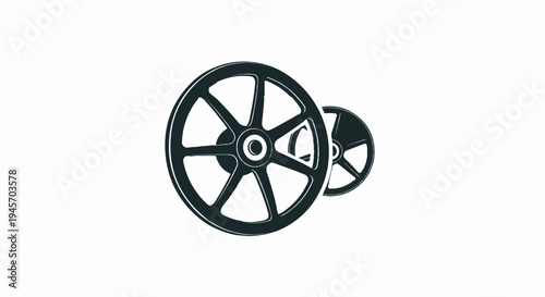 Two dark, industrial spoked wheels, one larger than the other, are depicted