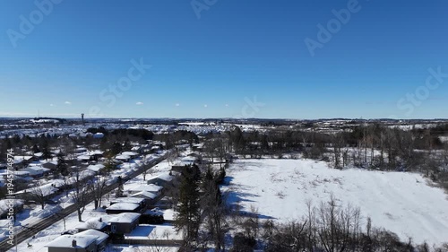 An aerial drone view of houses in winter