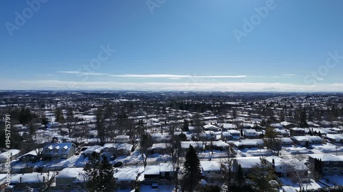An aerial drone view of houses in winter