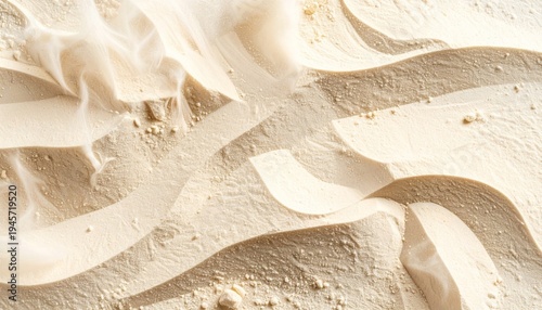 Close Up of Wavy Pattern in Pale Sand on Beach in Sunny Daylight