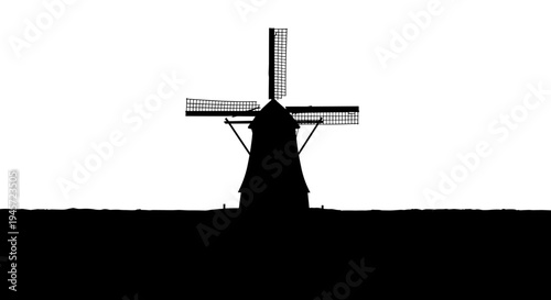 Silhouette of a windmill standing.