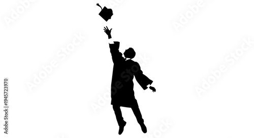Young man throwing graduation cap.
