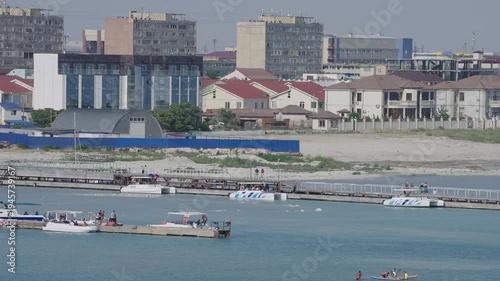 Interior view of an industrial aquaculture facility featuring circular tanks for fish farming