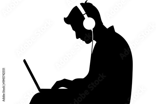 Silhouette of Person Using Laptop with Headphones