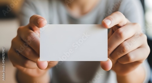 Wallpaper Mural man holding blank card Torontodigital.ca