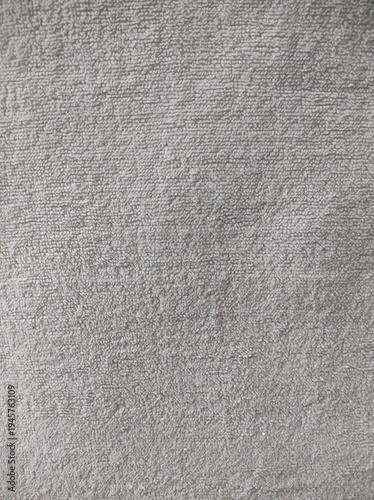 Soft Gray Fabric Texture With a Woven Pattern Visible in Natural Light During the Day in a Home Setting