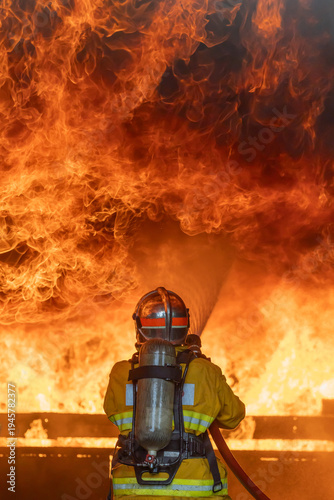 Firefighter try extinguish the blaze fire flame