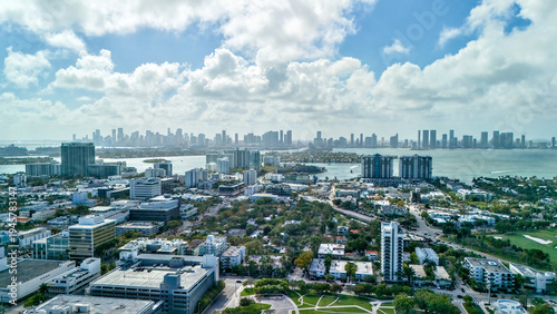 Drone panorama of coastal neighborhood with distant skyline Miami Beach