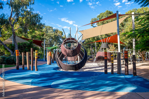 Fotografie Indigenous-inspired playground with woven baskets and colorful shade sails at Bi