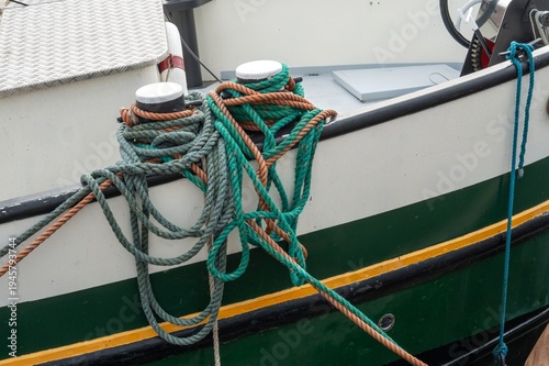 Mooring ropes securing boat to bollards