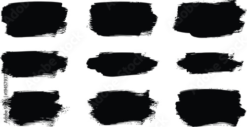 A collection of nine black ink brush strokes on a white background