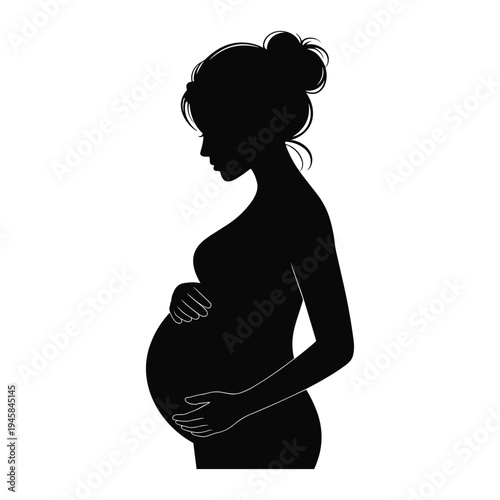 Black silhouette of pregnant woman with hands on belly