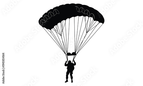 A person in silhouette parachuting through the air with a deployed parachute